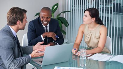 Executives engaged in a business consulting discussion to evaluate opportunities and improve performance